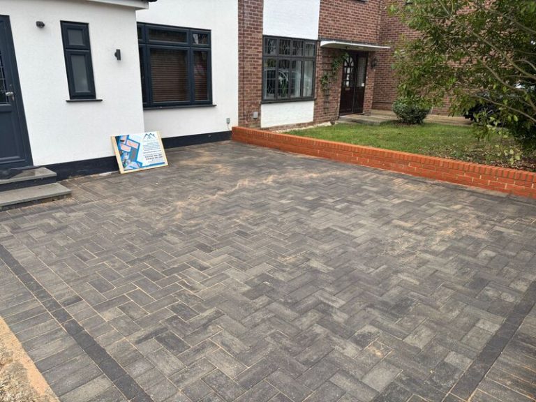block paved driveway with brick wall in romford 24